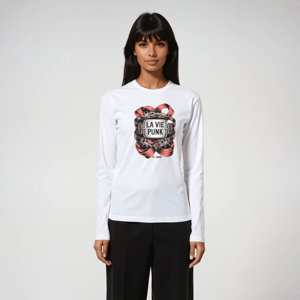 Woman wearing white long-sleeve tee with La Vie Punk Paris in Chains graphic, styled with black tailored pants.