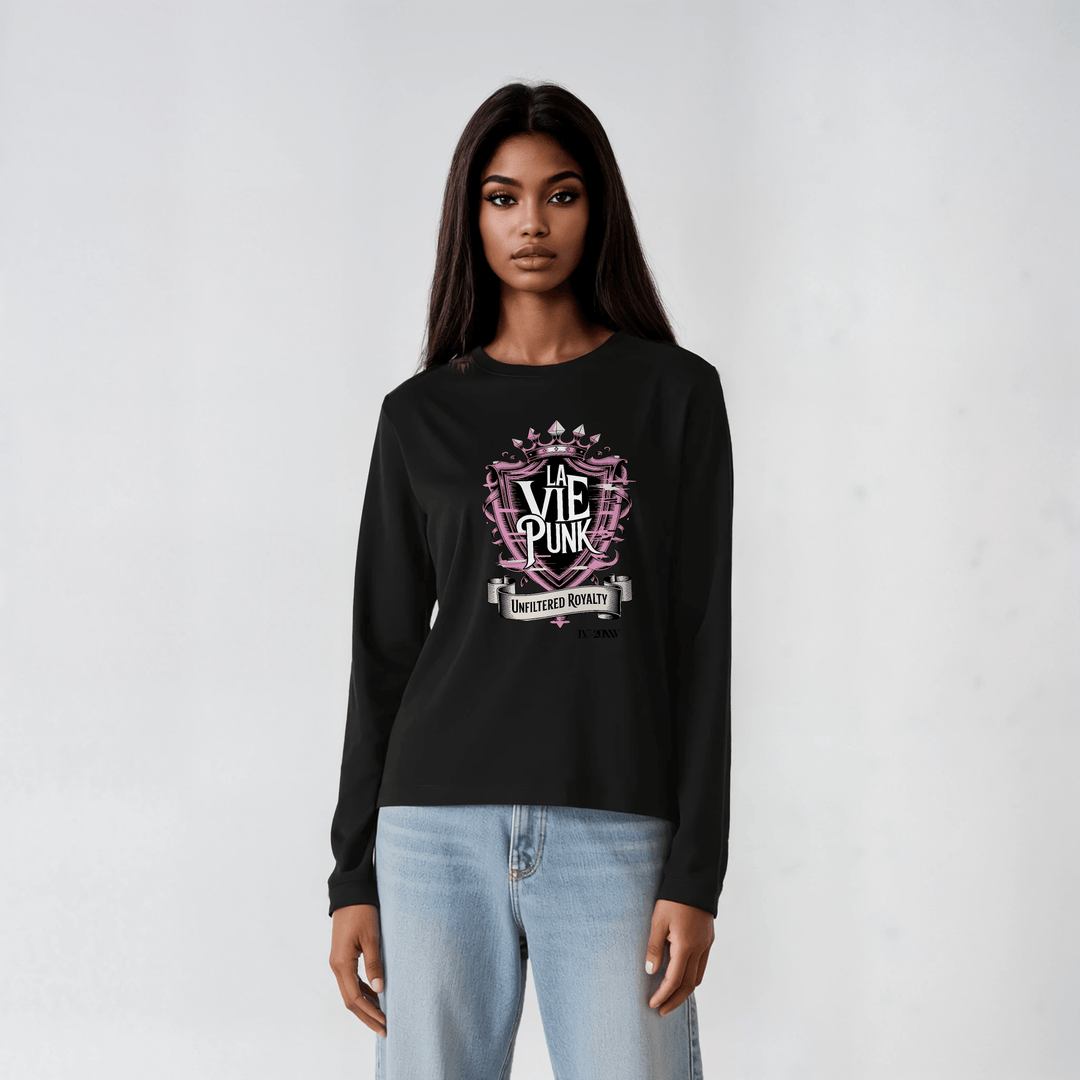 Model in black long-sleeve tee featuring pink crest-style “La Vie Punk” graphic with ‘Unfiltered Royalty’ detail, styled with light denim.