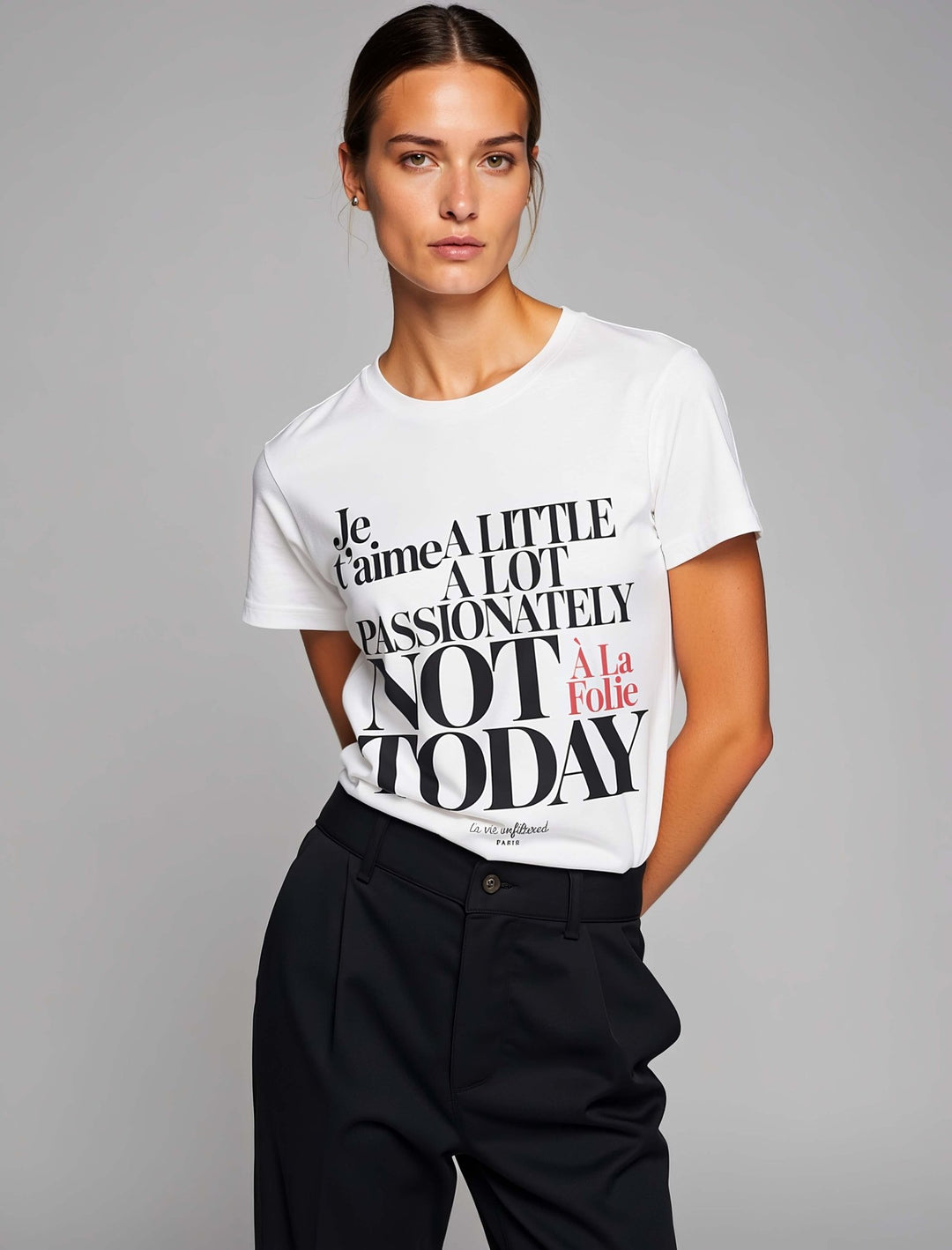 Model wearing White with The Paris Paradox graphic by La Vie unfiltered
